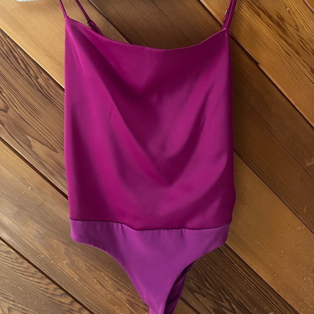 Beautiful satin fuchsia bodysuit. Adjustable straps, and back zipper.